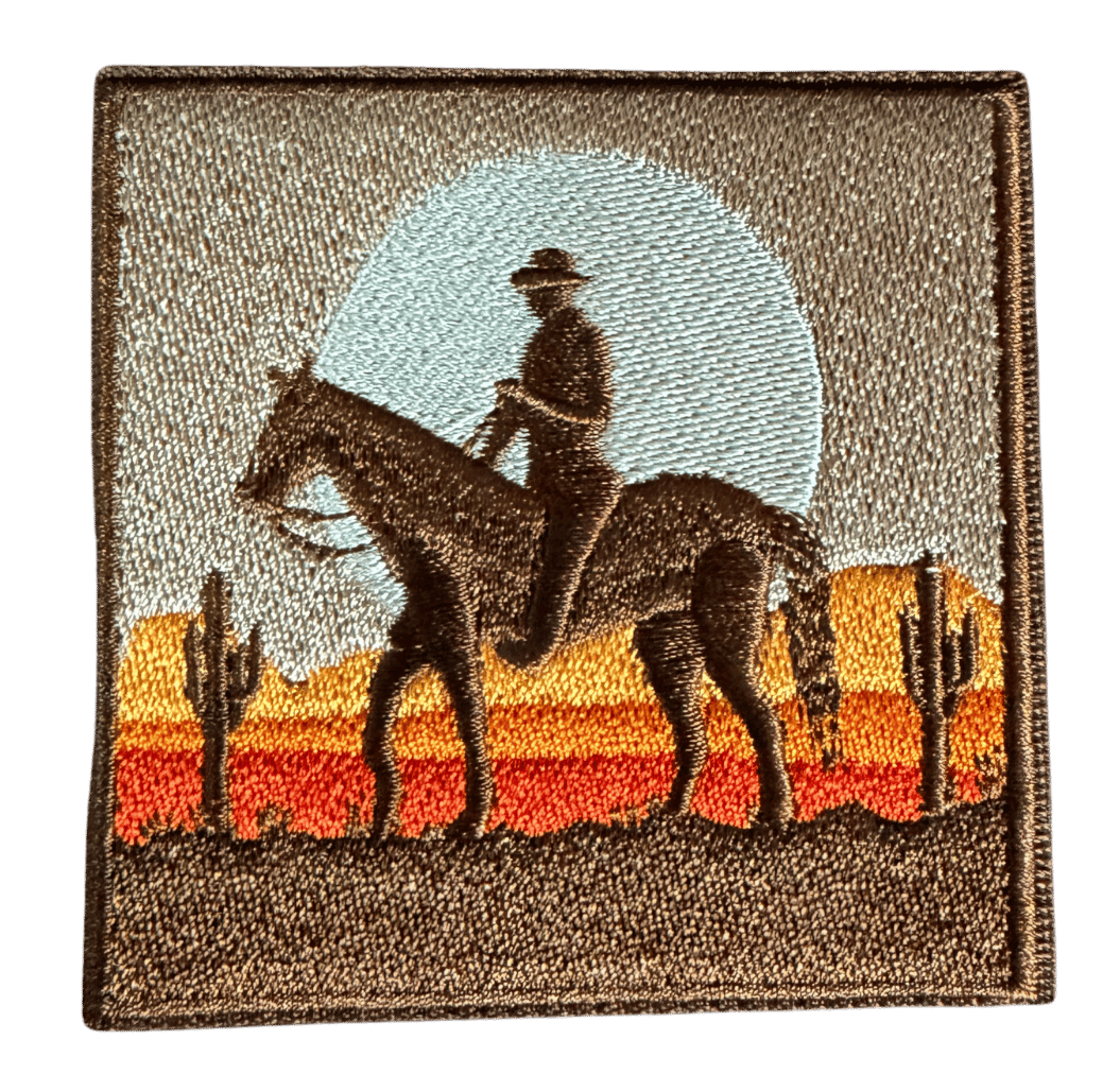 Desert Cowboy embroidered patch with horseback silhouette and desert sunset