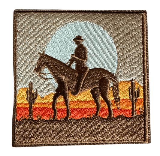 Desert Cowboy embroidered patch with horseback silhouette and desert sunset
