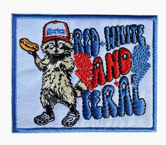 Red White and Feral embroidered patch with raccoon holding hot dog