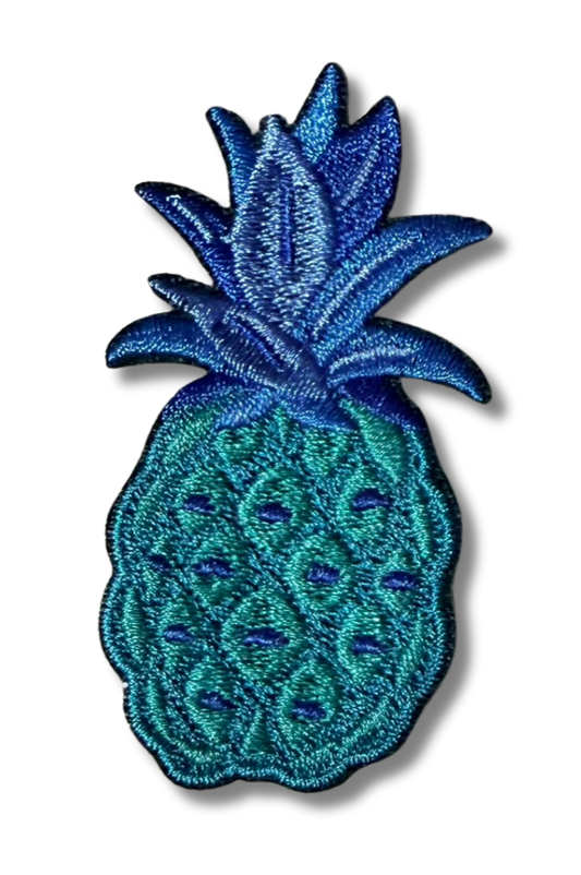 Blue pineapple embroidered patch from High Desert Hats featuring detailed stitching on a fabric background.