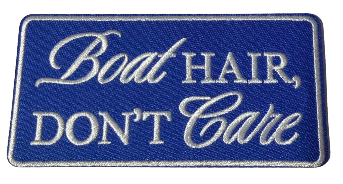 Embroidered "Boat Hair Don't Care" patch by High Desert Hats, featuring nautical-themed text and vibrant stitching on fabric.