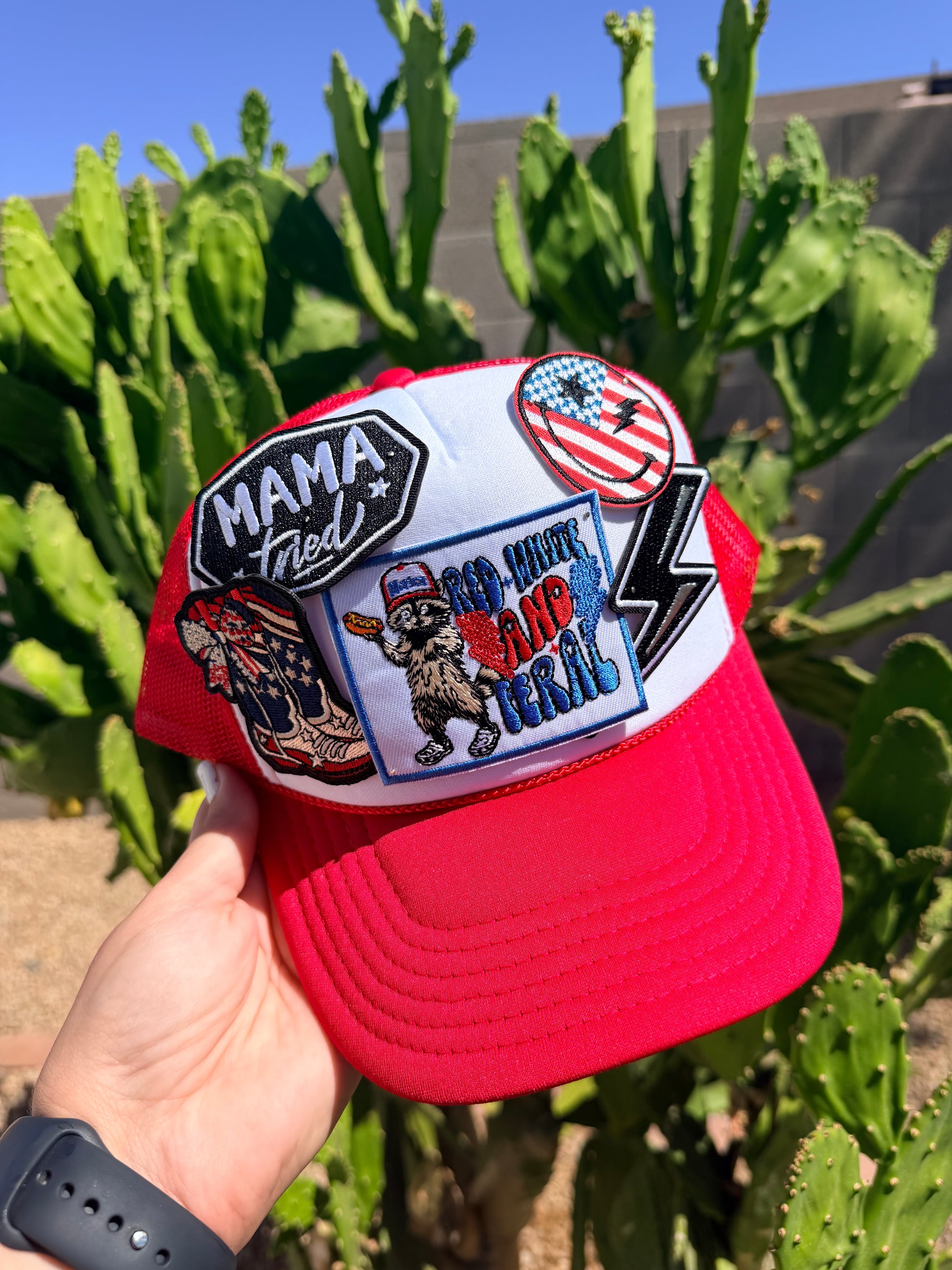 Red, white, and feral themed hat by High Desert Hats with a structured brim and adjustable strap, showcasing a bold, stylish design.