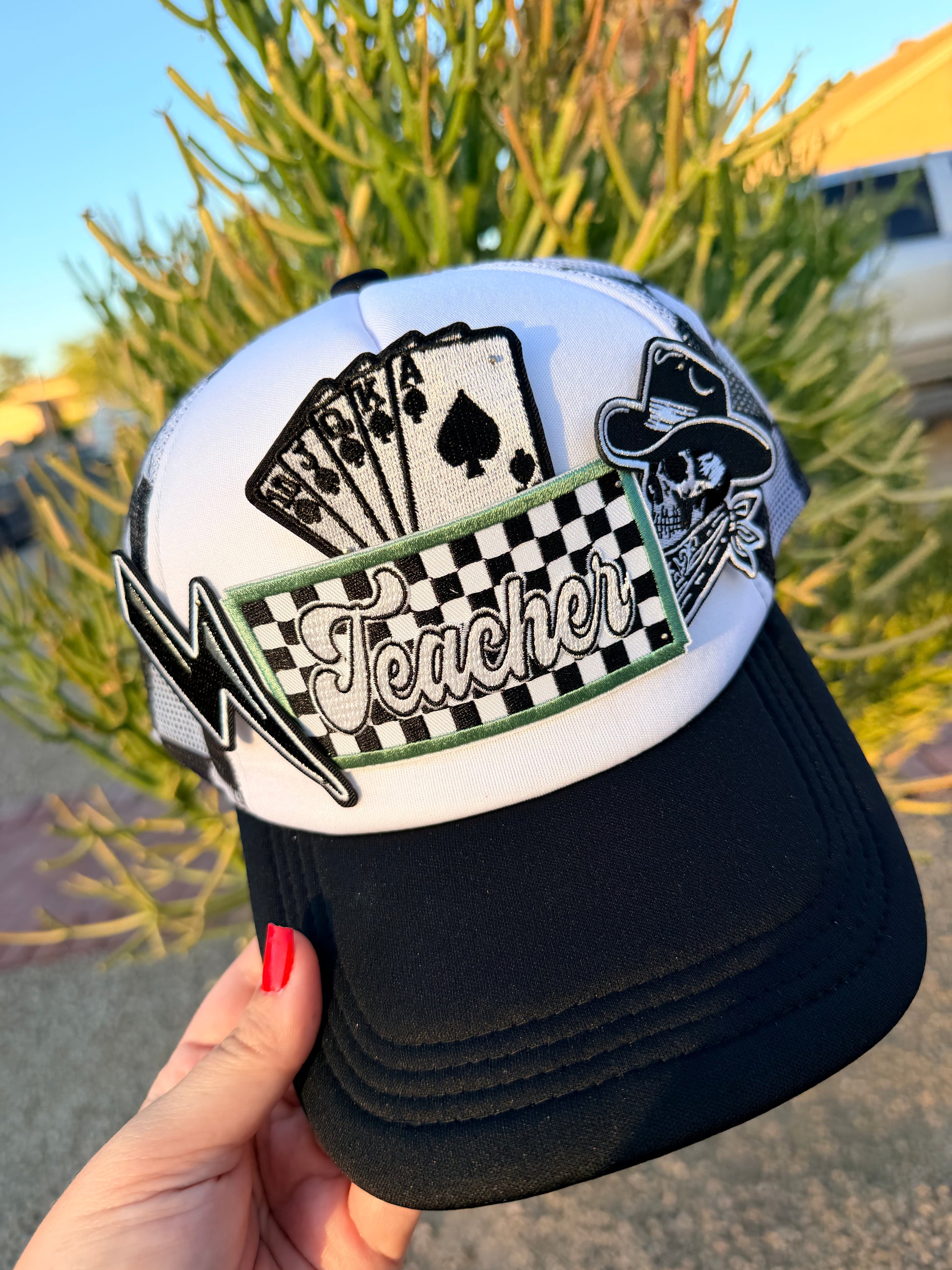 High Desert Hats Teacher Outlaw premade trucker hat with embroidered design, adjustable snapback, and classic mesh back for casual style