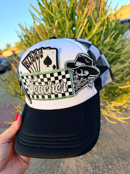 High Desert Hats Teacher Outlaw premade trucker hat featuring a classic mesh back and embroidered front design.