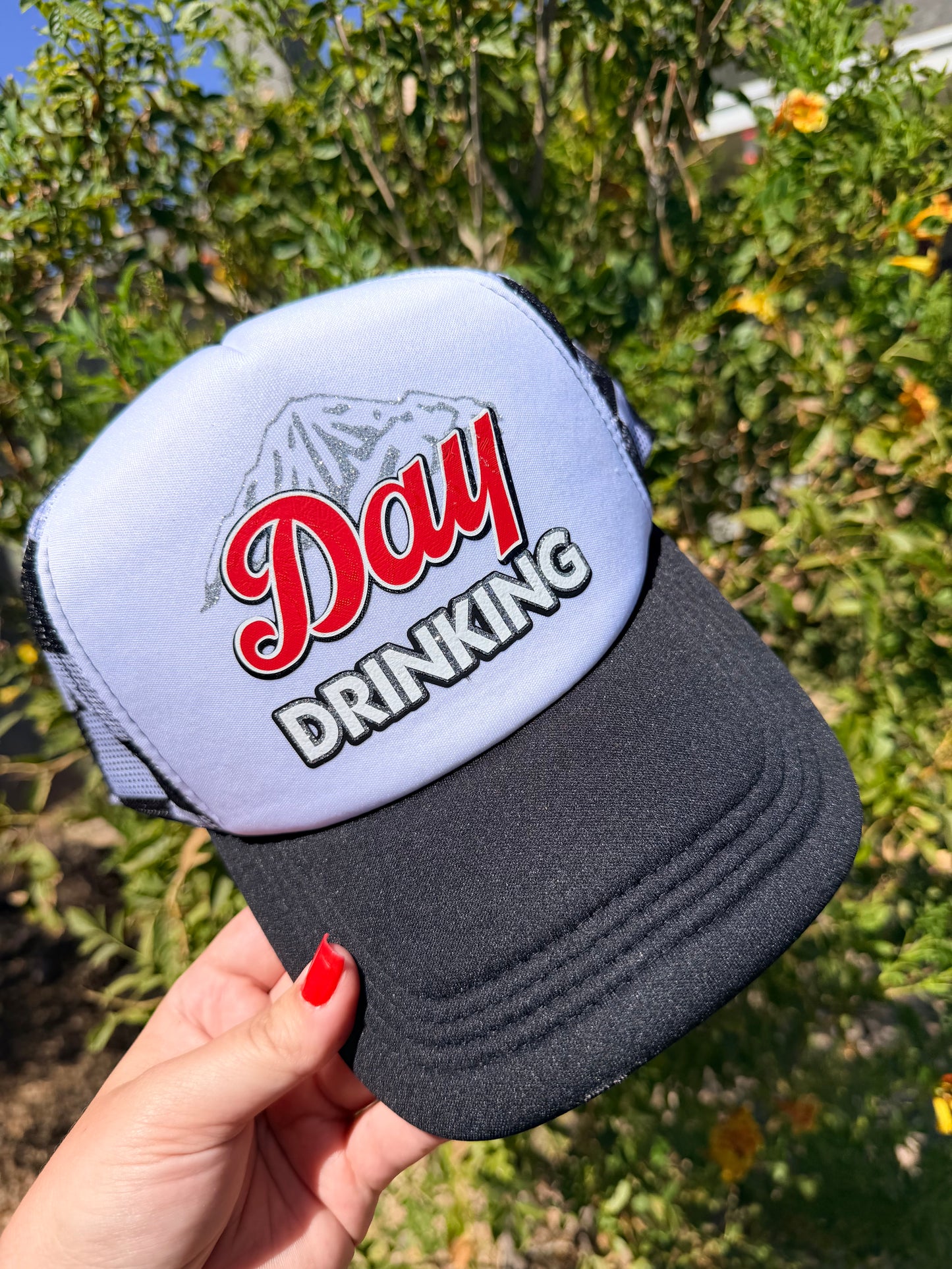 High Desert Hats Day Drinking premade trucker hat with mesh back and embroidered front design, casual outdoor headwear.