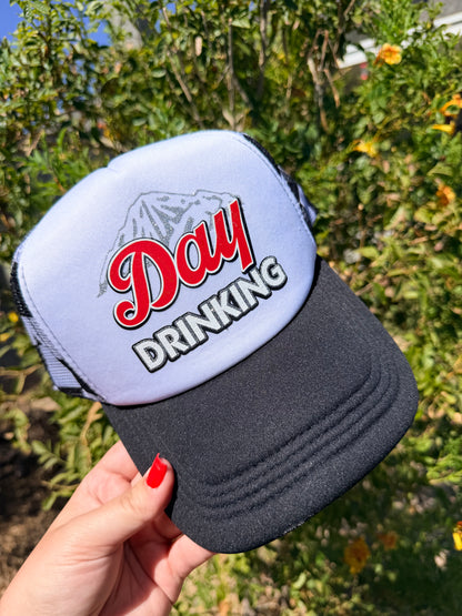 High Desert Hats Day Drinking premade trucker hat with mesh back and embroidered front design, casual outdoor headwear.