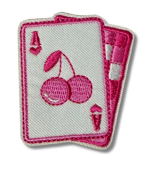 Pink cherry checkered embroidered patch from High Desert Hats featuring detailed stitching and vibrant colors.