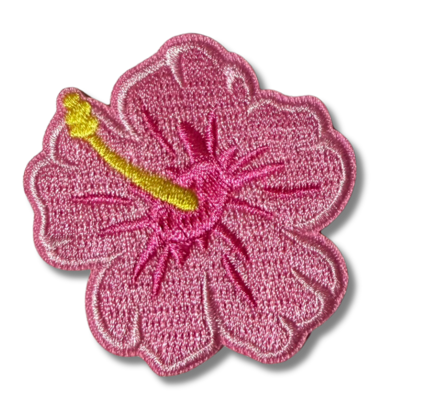 Pink hibiscus embroidered patch with detailed floral design, perfect for decorating hats or clothing by High Desert Hats.