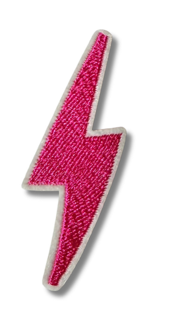 Small pink lightning bolt embroidered patch from High Desert Hats featuring vibrant pink lightning design on fabric background.