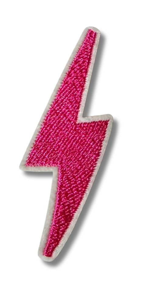 Small pink lightning bolt embroidered patch from High Desert Hats featuring vibrant pink lightning design on fabric background.