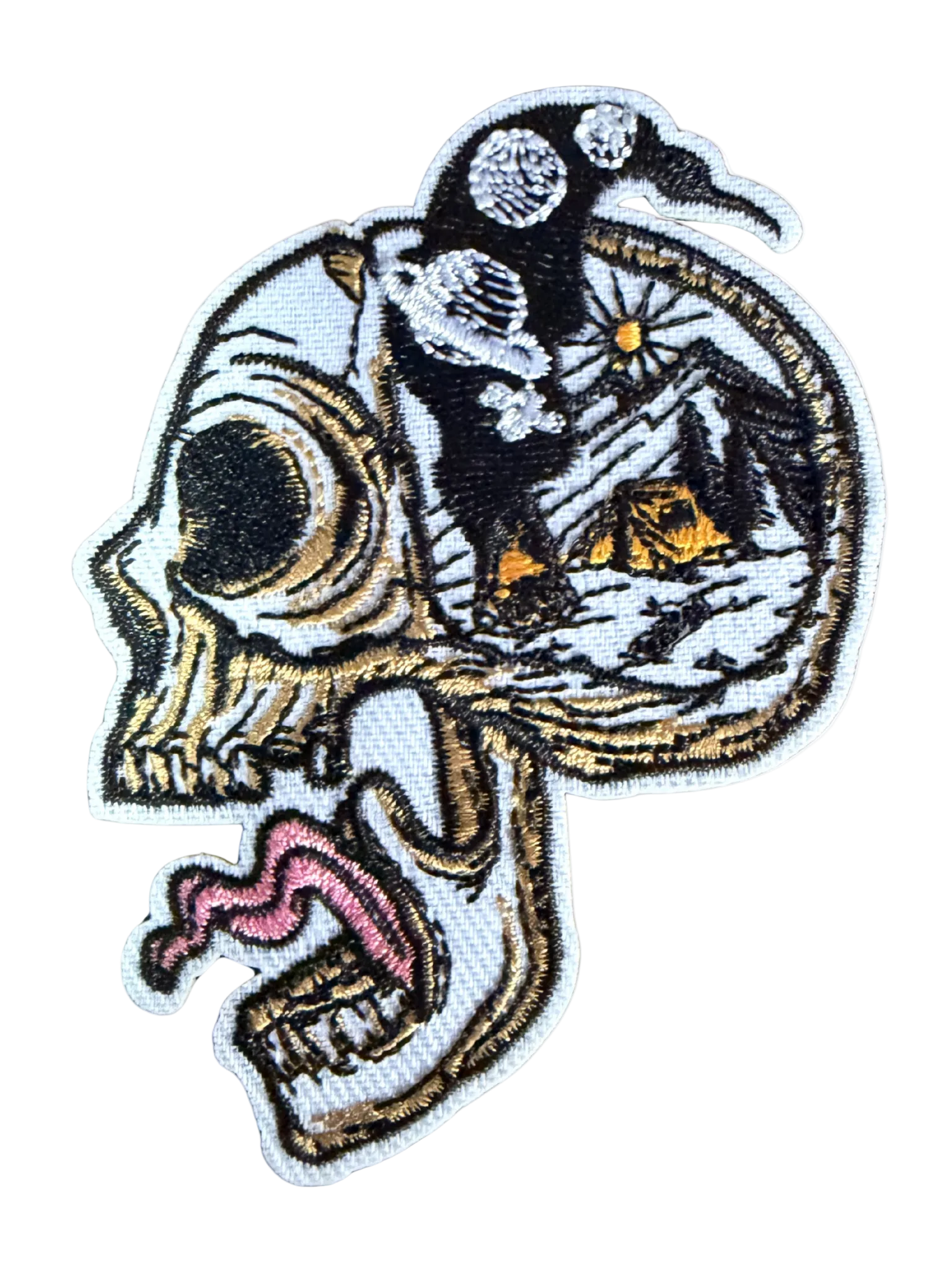 Skull side profile with open cranium showing mountain camping scene under starry night sky patch