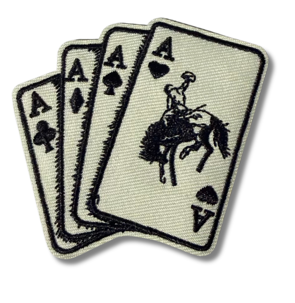 High Desert Hats Western Cards embroidered patch with detailed stitching, showcasing a Western-themed design on fabric.