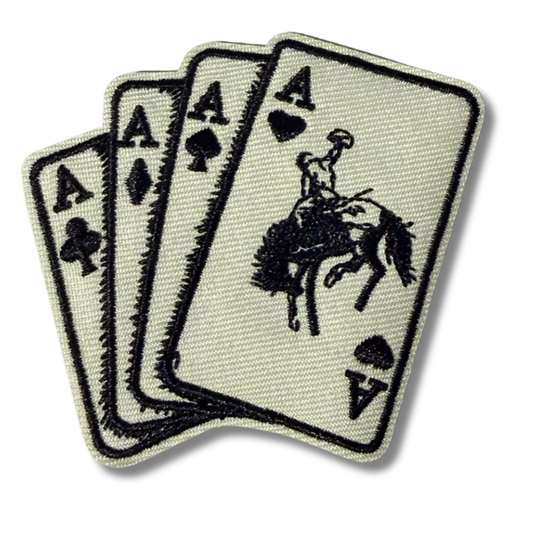 High Desert Hats Western Cards embroidered patch with detailed stitching, showcasing a Western-themed design on fabric.
