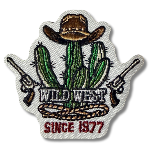 Wild West embroidered patch by High Desert Hats featuring detailed western-themed design on fabric background.
